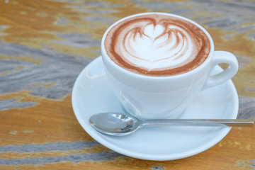 Hot chocolate in a white cup on table