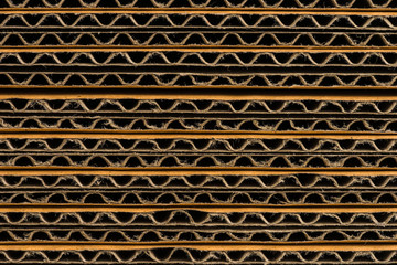 stack of corrugated cardboard boxes background. side perspective