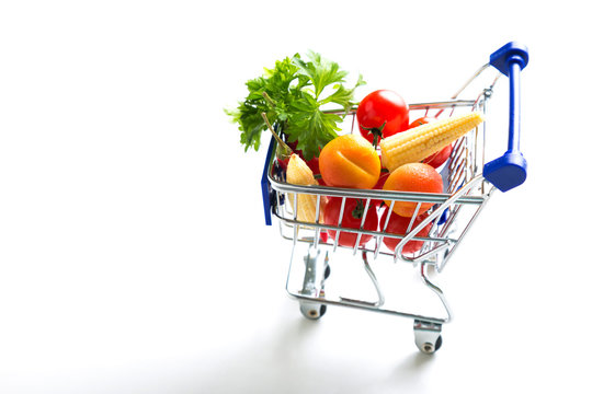 Shopping Basket with fresh vegetables on a white background