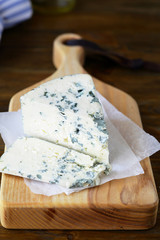 Roquefort cheese on chopping board