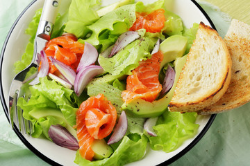 avocado salad with slice of salmon