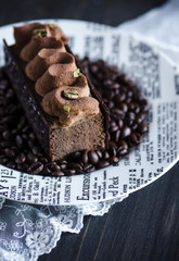 Opera cake on a dark  background.