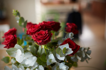 Arrangement Of Red Roses On Table