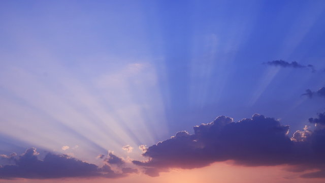 time lapse of sun rays emerging though the clouds tilt down to home village, Sunrise or sunset (reverse).
