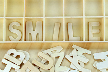 Word smile made with wooden letters alphabet