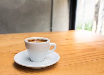 Coffee cup on the wooden table