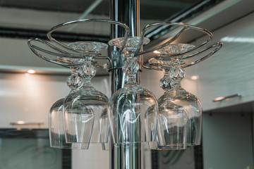 Holder with wine glasses to the bar