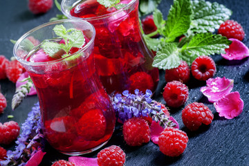 Herbal red tea with raspberries, mint, sage flowers and rose pet