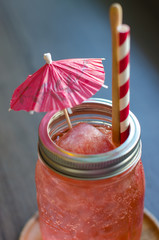 Cold Strawberry Italian soda in a glass with ice cubes