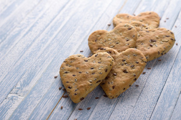 Healthy homemade cookies with flax seed on a blue surface
