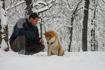Man and dog in the snow