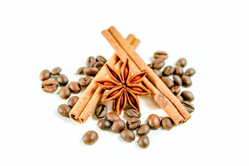 a cup of cappuccino  with cinnamone and star anise isolated on white