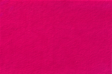 Fototapeta premium Bright pink Felt Background for design. View from above. Close up.