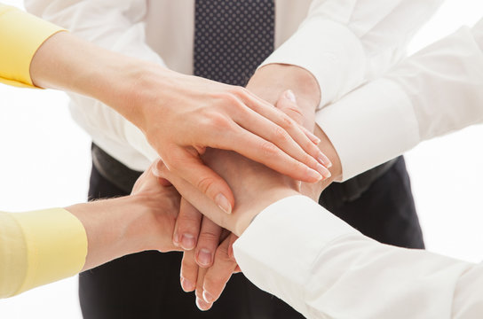 Business people uniting their hands - gesture of a uniion