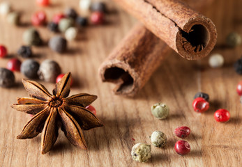 Pepper mix, cinnamon,  truestar on wooden  background