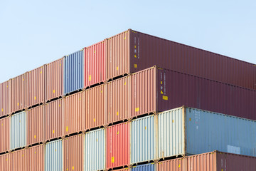 The stack of container in the ship yard at the port before export process