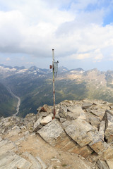 Summit cross on mountain Wildenkogl with panorama in Hohe Tauern Alps, Austria