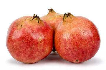 Fruits of pomegranate (Punica granatum) on white background. Clipping path incl.
