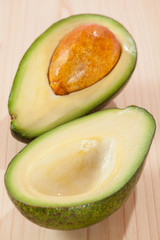 Appetizing avocado on wooden table