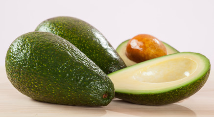 Appetizing avocado on wooden table
