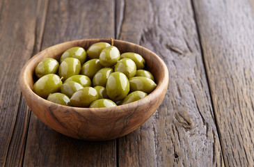 Olives in a wooden plate