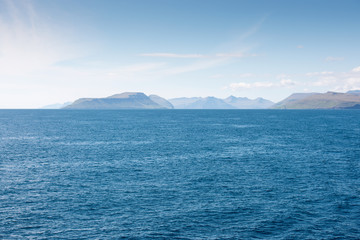 Fototapeta premium Landscape on the Faroe Islands as seen from a ship