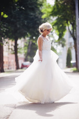 Fototapeta na wymiar Young beautiful bride posing outdoors