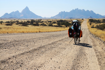 Long distance cycling at Spitzkoppe, Namibia