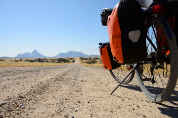 Long distance cycling at Spitzkoppe, Namibia