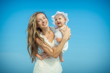 Happy beautiful mother and daughter enjoying