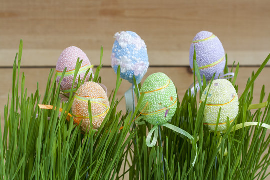 Row of Easter eggs in fresh green grass