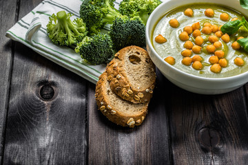 Broccoli soup or cream soup on wood..