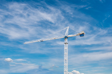 The site with cranes against blue sky