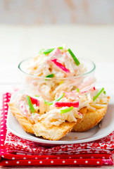 salad from crab sticks on toasts from baguettes