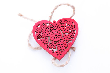 Wooden red heart isolated on white background