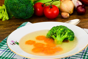 Obraz na płótnie Canvas Chicken Broth with Broccoli and Carrots