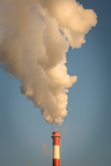 Smoke from the chimney and blue sky