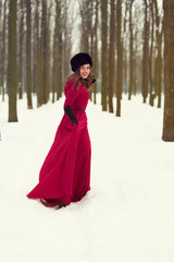 Beautiful woman in winter forest