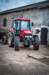 Fotobehang Tractor standing in the yard in rural areas © Radek Ziemniewicz