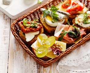 Canapes with various toppings, delicious breakfast or snack