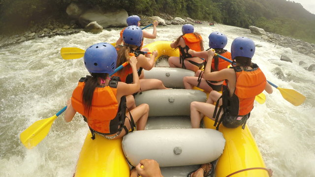 Experience the thrill of extreme white water rafting with a group of young,sexy girls in bikinis,captured on camera with immersive sound.