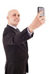Businessman taking a selfie isolated on white background