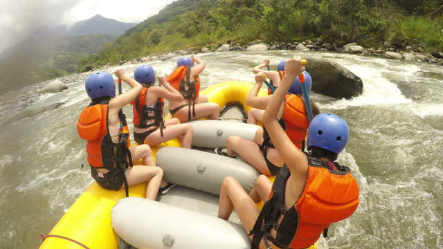 Experience the thrill of extreme white water river rafting as a skilled pilot guides a team of young girls through the rapids with precise commands and exhilarating sounds.