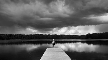 Boy standing on a Footbridge