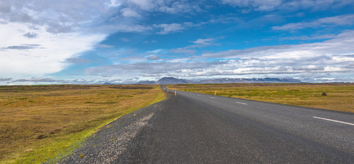 Isolated road and Icelandic colorful landscape at Iceland, summe