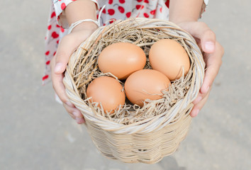 Fresh eggs in basket.