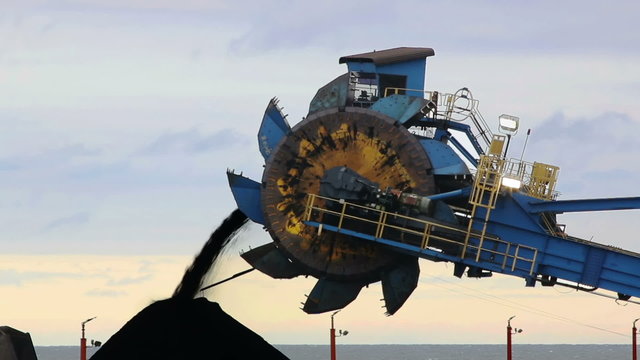 Coal is piled with heavy machinery before being transported from a Lake Erie port in Ohio.