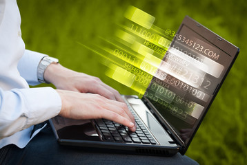 Close up of man typing on laptop computer