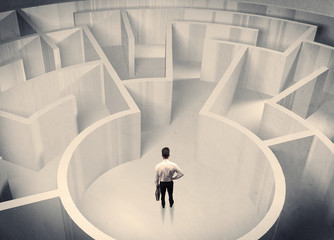 Business person standing in maze center