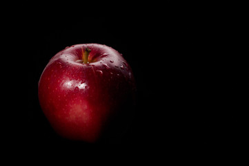 Fototapeta na wymiar red apple black background
